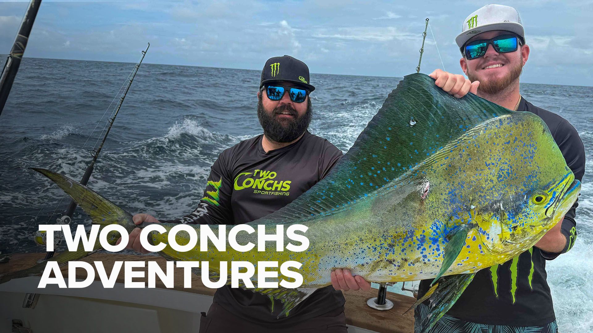 Two Conchs Adventures - two men holding up a Mahi-Mahi that they caught